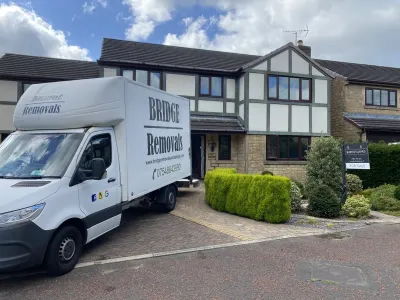 Bridge Removals van in the driveway of a mock-Tudor house in Waterfoot