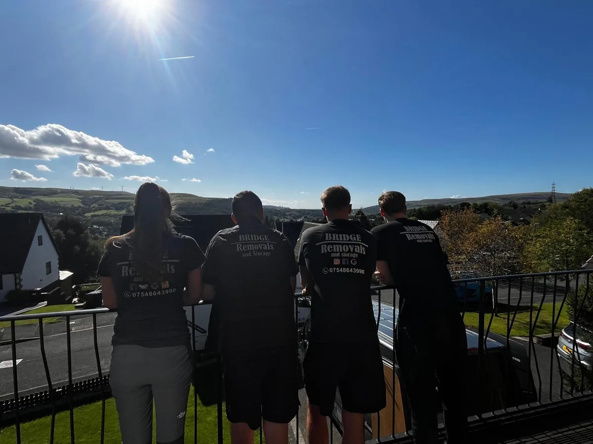 Bridge Removals crew taking in a valley view from a railing between jobs Bridge Removals crew taking in a valley view from a railing between jobs