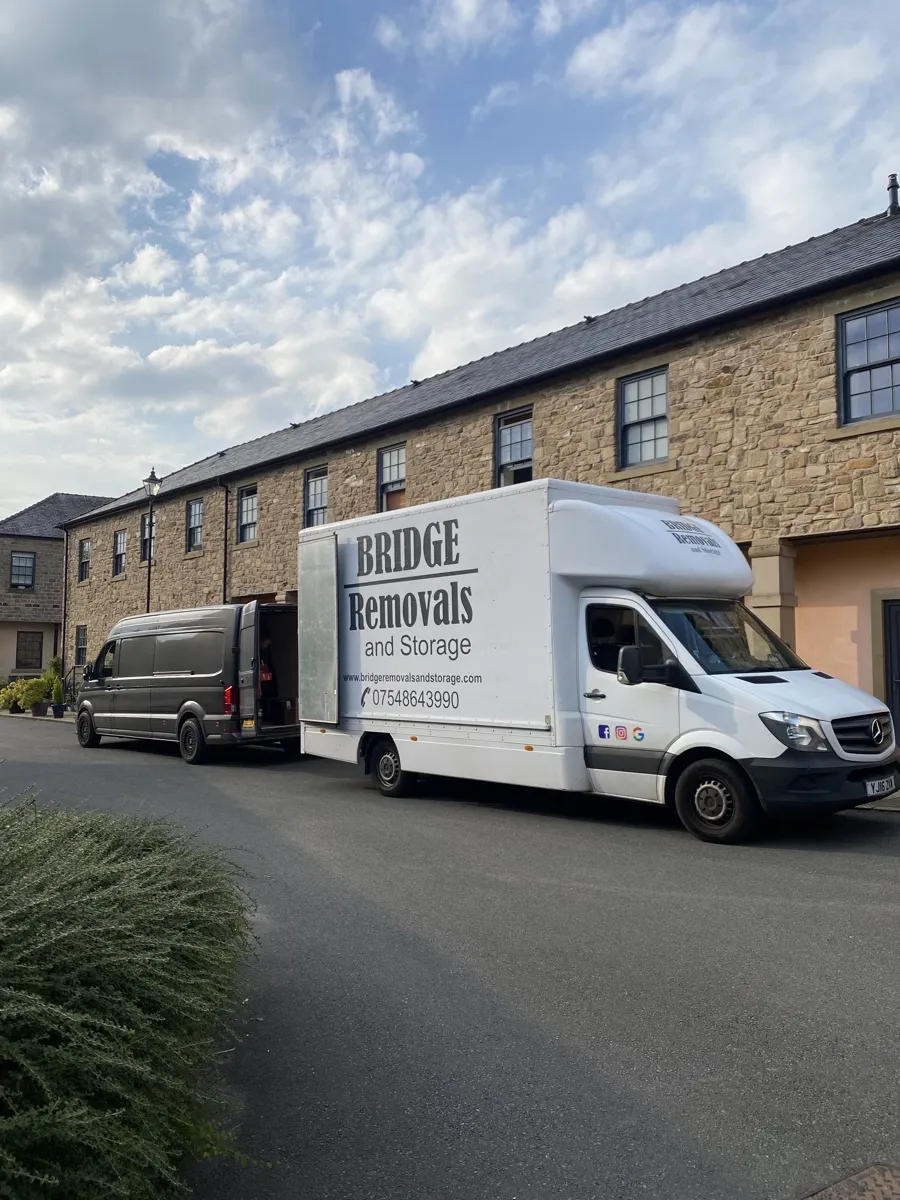 Bridge Removals van outside a long stone terrace in Horwich Bridge Removals van outside a long stone terrace in Horwich