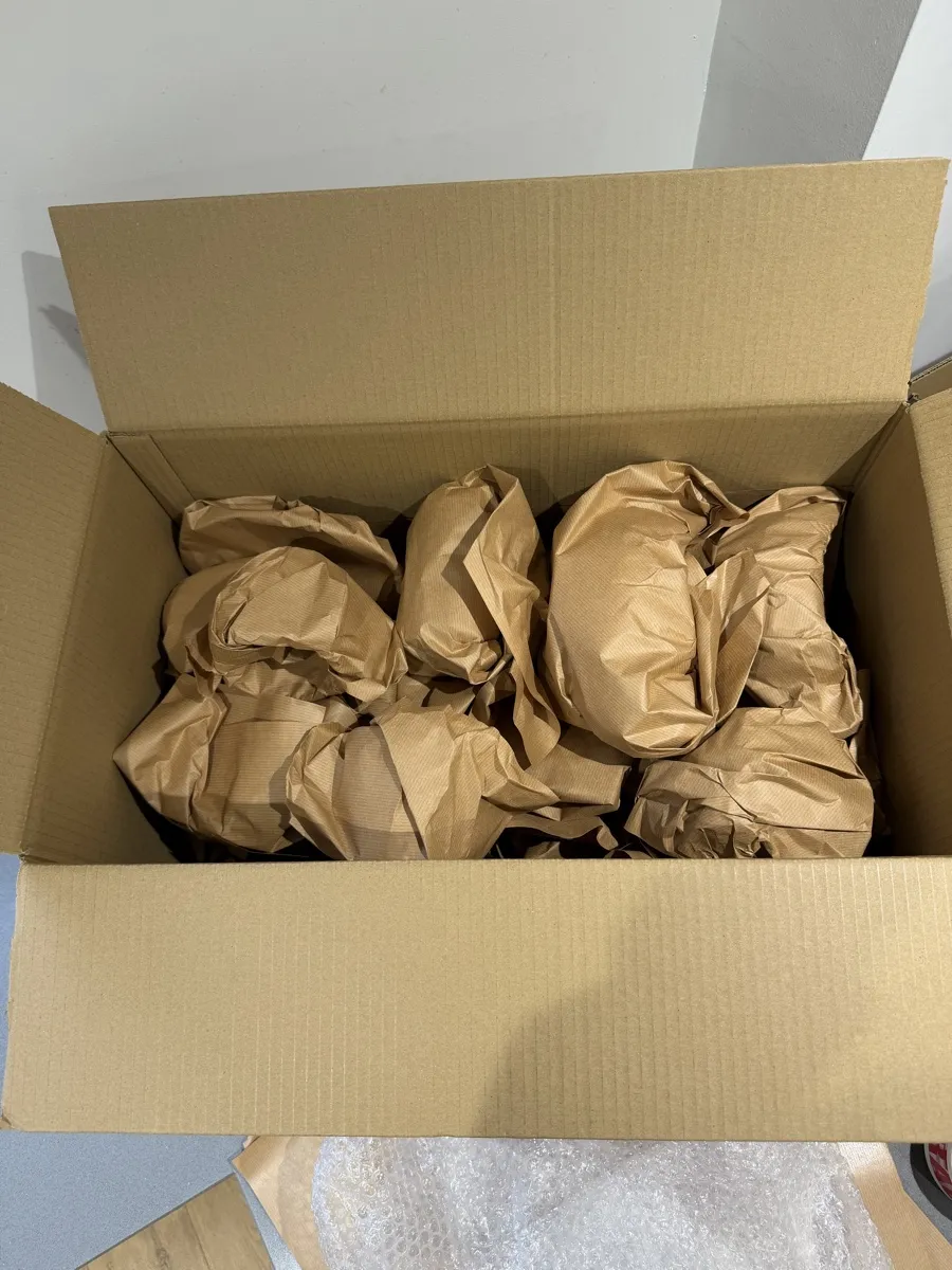 A box of items wrapped in kraft paper, packed by Bridge Removals ahead of a house move. A box of items wrapped in kraft paper, packed by Bridge Removals ahead of a house move.
